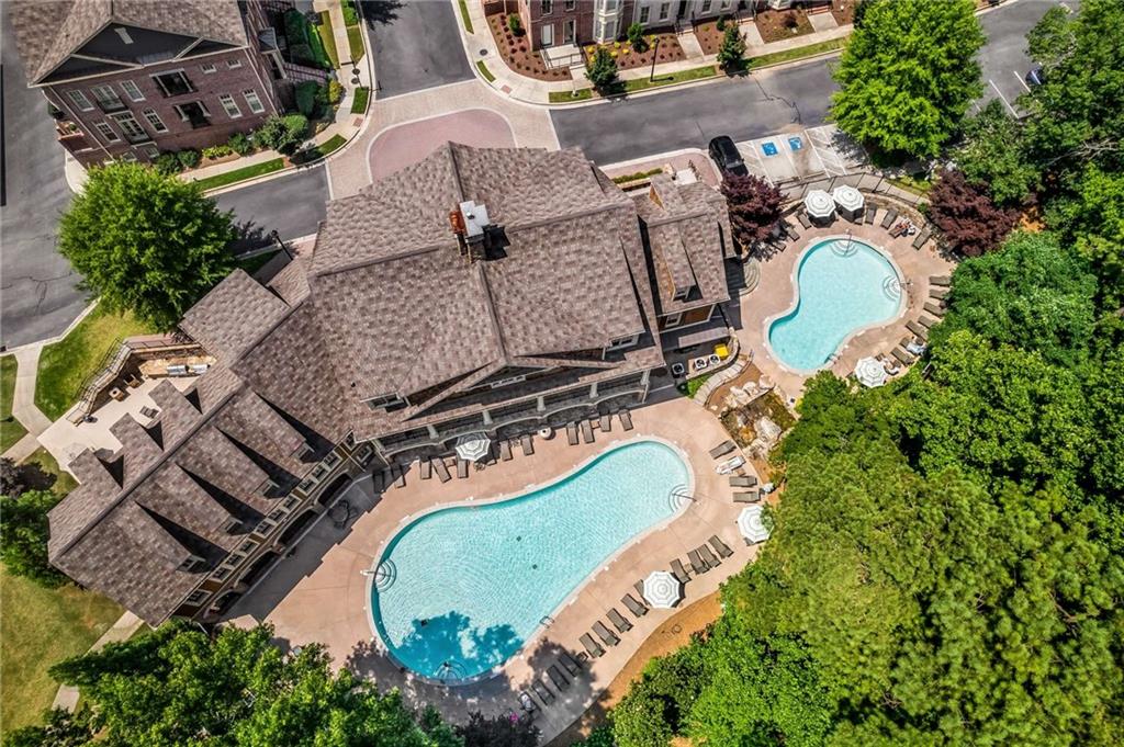 An overhead shot of the Meeting House, 2 pools, waterfall and green space that fill the landscape for lots of privacy.