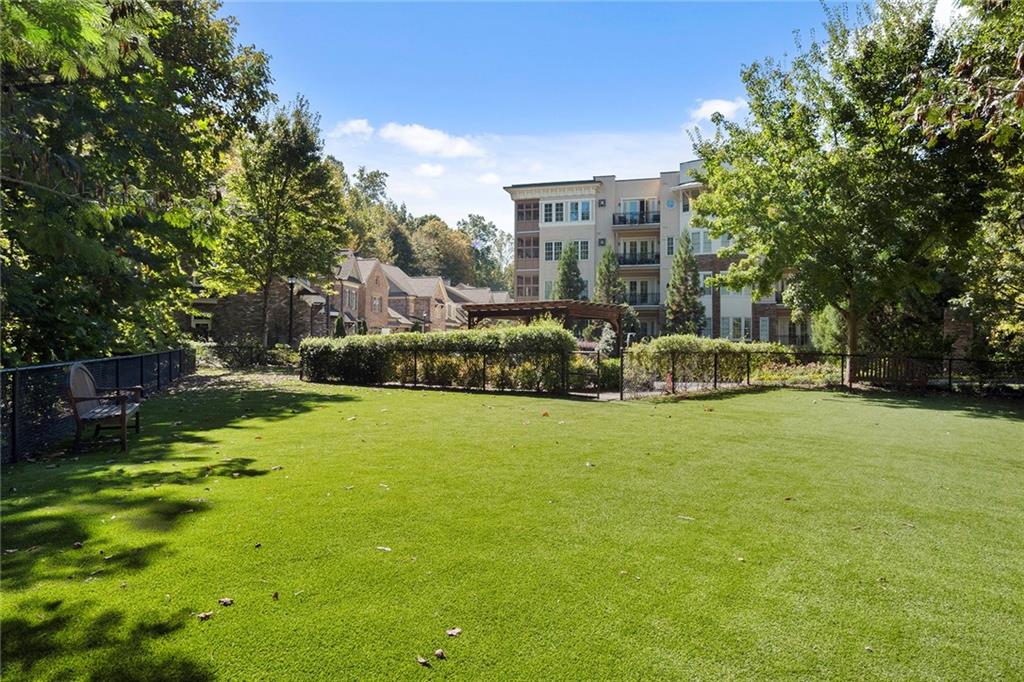 This dog park was recently upgraded to include new artificial grass, benches and shade.  This is an extremely dog friendly community!