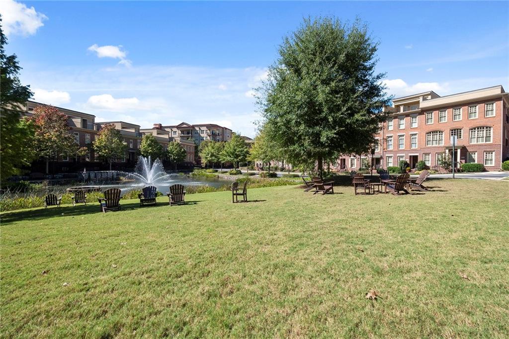 There are two other green spaces that are large and flat. They are perfect to walk your pet or throw a ball!  This area by the pond has weekly, informal, get togethers by the neighbors, especially on Friday evenings.  Bring your favorite beverage and catch up with your neighbors.  One River Place is extremely welcoming to newcomers!