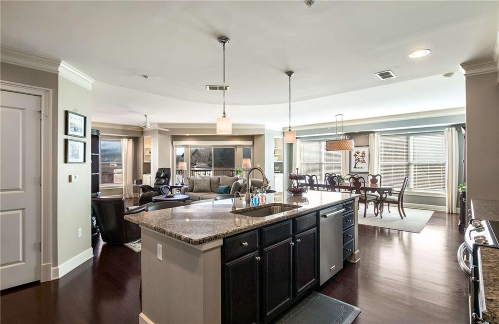 Natural light pours into the living space with this wall of windows that overlook the small creek on the property.  Neighborhood backs up to protected forest.  This unit is like a treetop view of the property and neighboring woods.