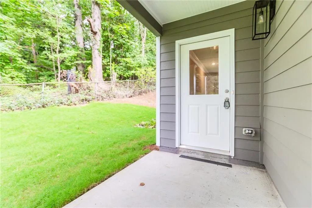 Entrance to property featuring a patio