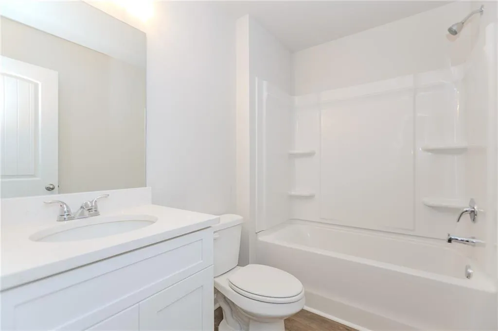 Bathroom with shower / bath combination and vanity