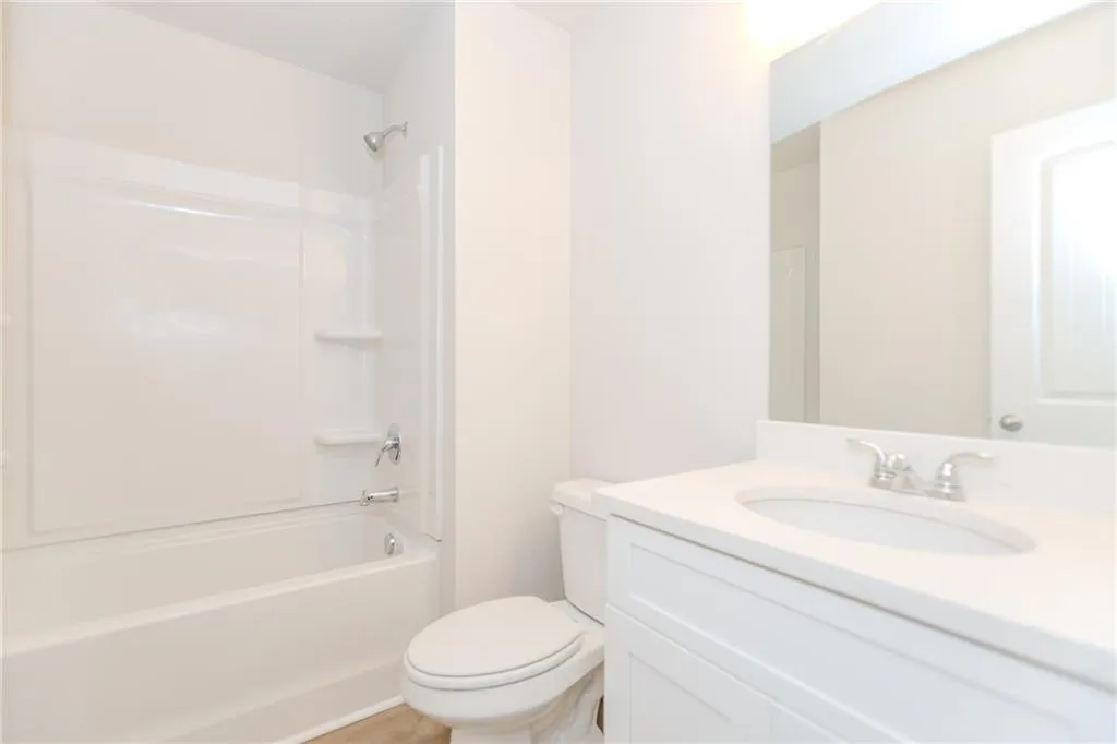 Bathroom featuring bathing tub / shower combination and vanity