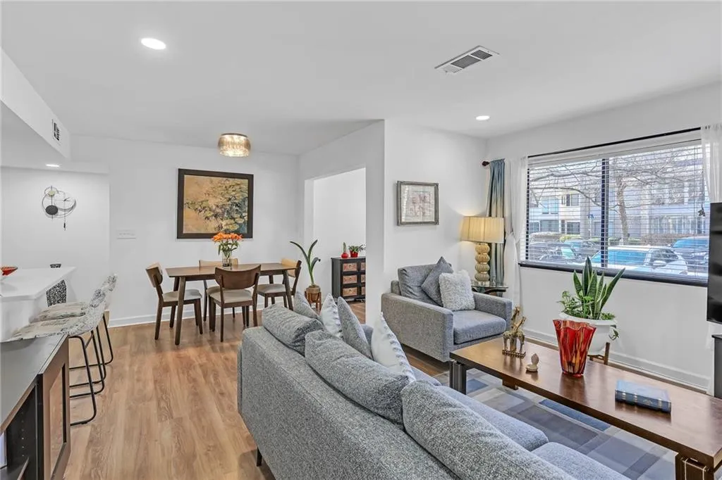 Living room featuring light wood-type flooring and recessed lighting