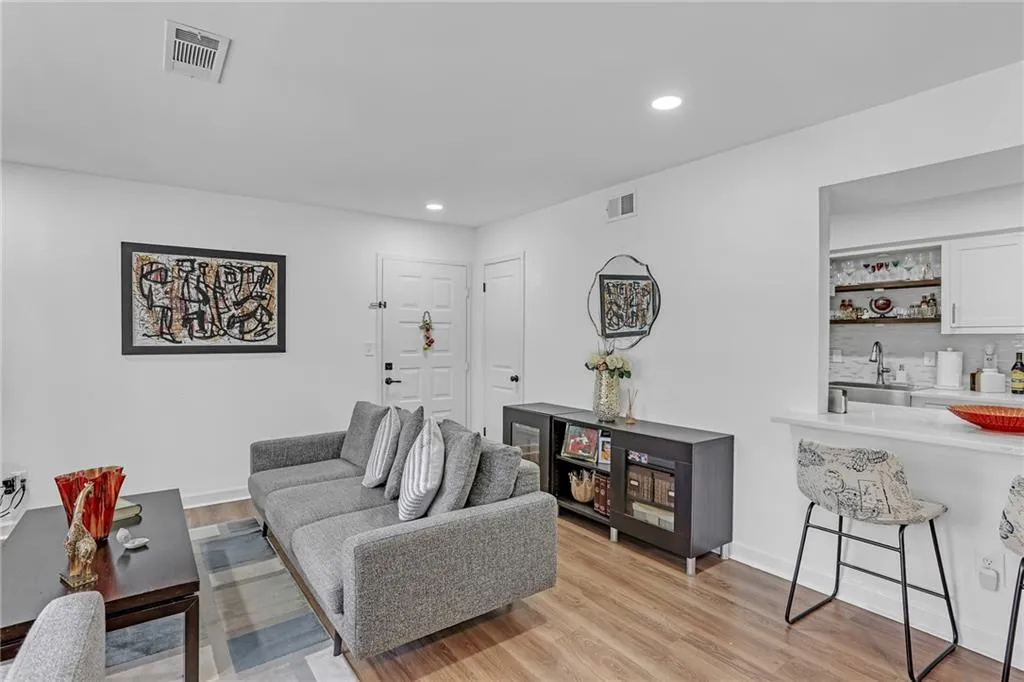 Living area featuring recessed lighting and light wood finished floors