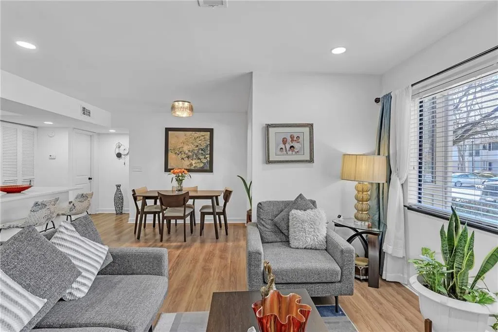 Living area featuring light wood-type flooring and recessed lighting