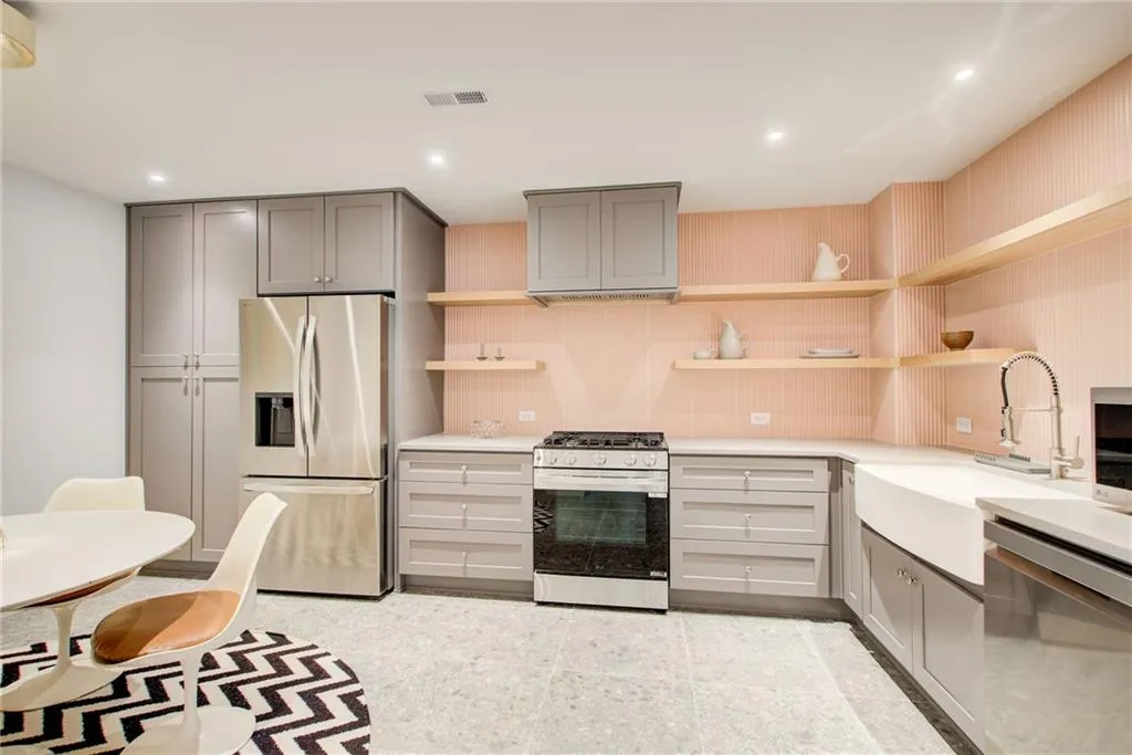 Brand new full kitchen on terrace level featuring stainless steel appliances, open shelves, apron sink, and recessed lighting