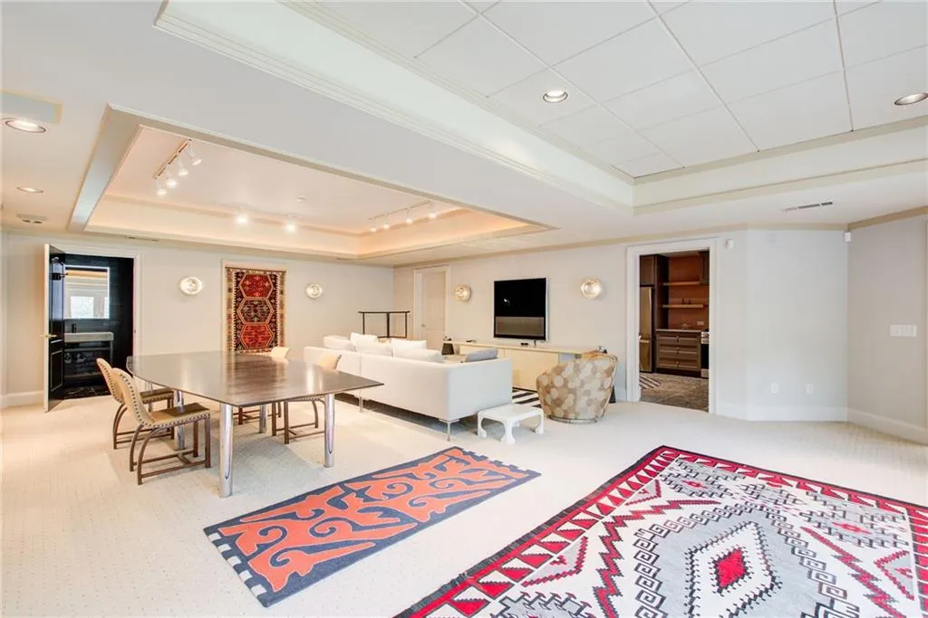 Enormous terrace level family room with high ceilings.