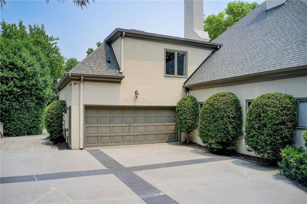 Two of three garage spaces. The other is a detached single garage opposite of attached garage