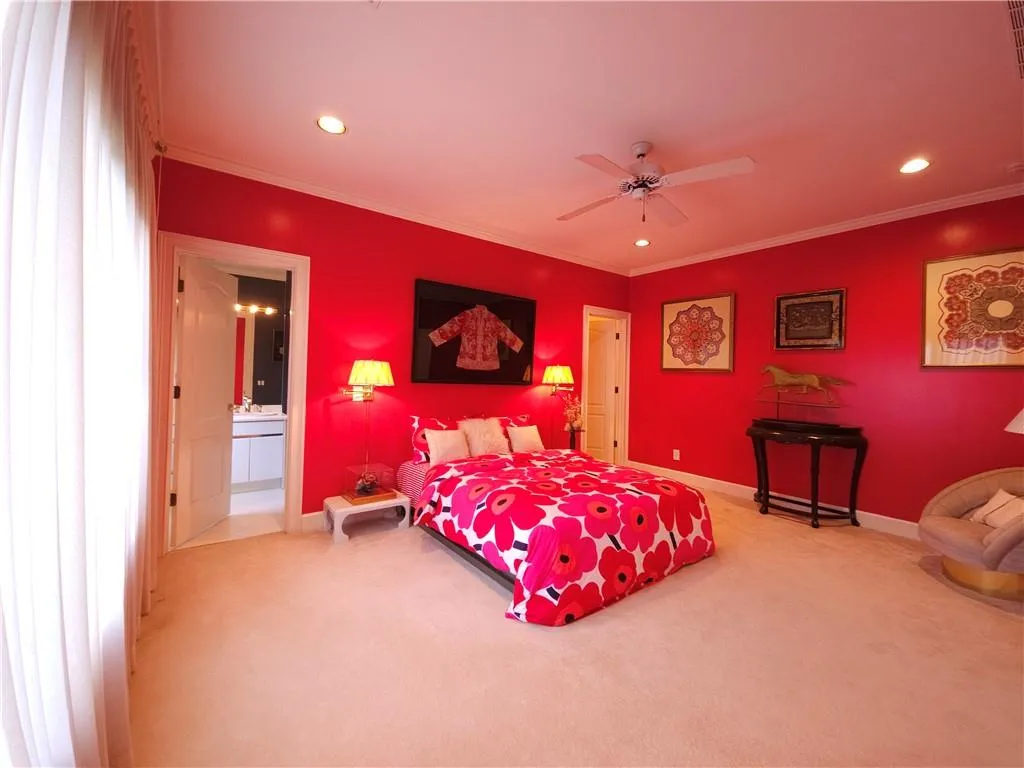 Upstairs you'll find one of two generously sized secondary bedrooms, complete with ensuite bath and walk-in closet.