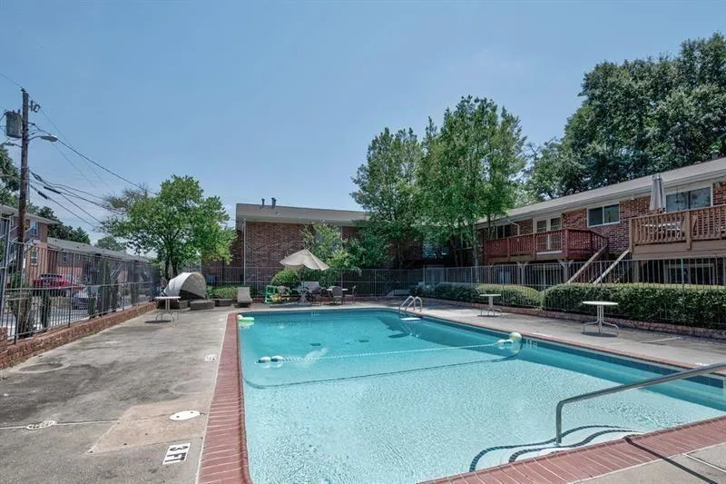 Community pool with a patio area