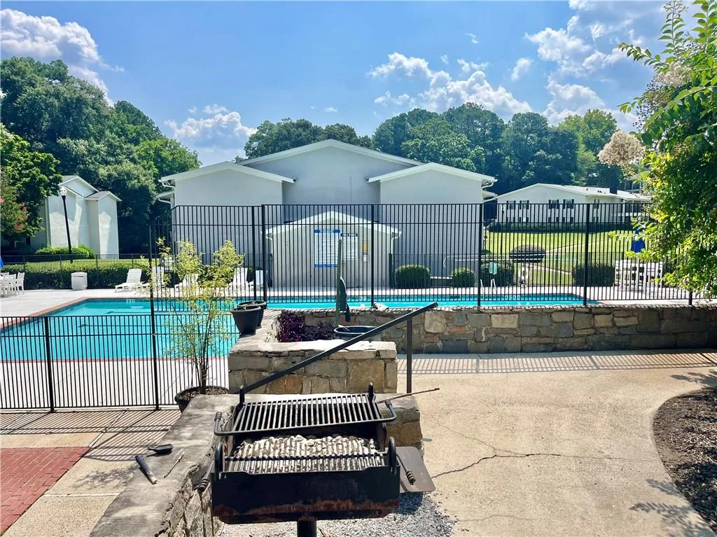 Community pool featuring a patio area