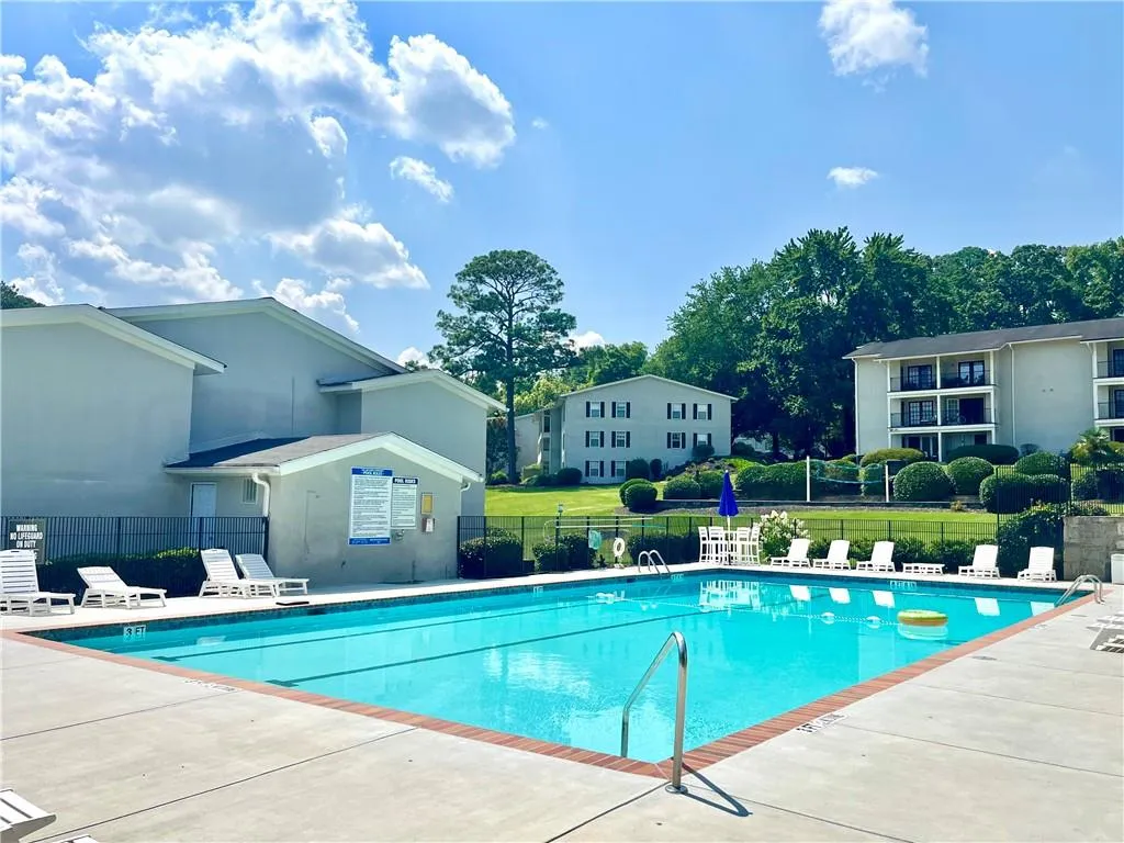 Community pool featuring a patio area