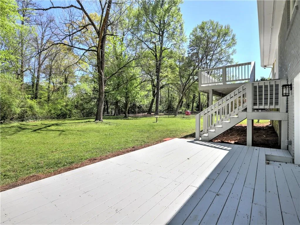 Wooden terrace with a lawn