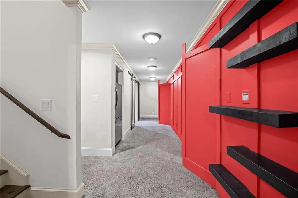 Full finished basement with hidden doors leading to theater and home gym