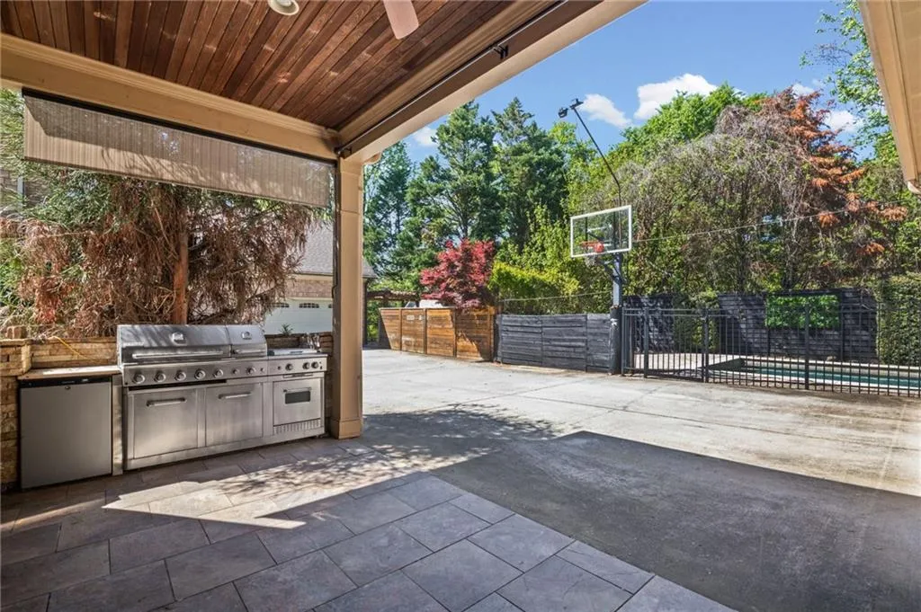 Patio of kitchen and living area with built-in grill