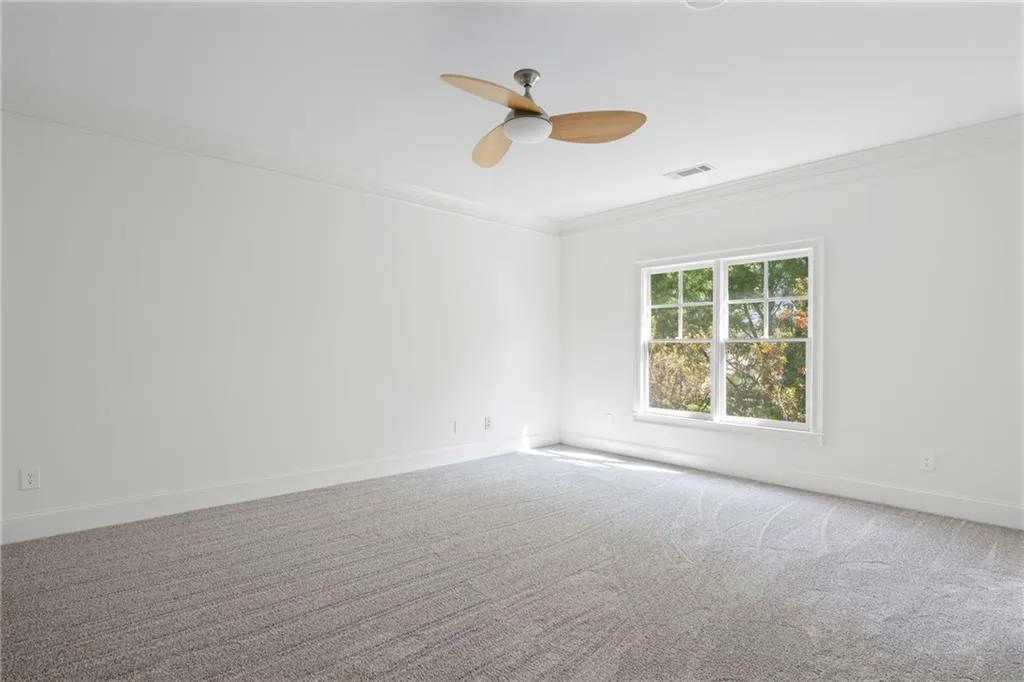 Secondary bedroom with ensuite bath and walk in closet