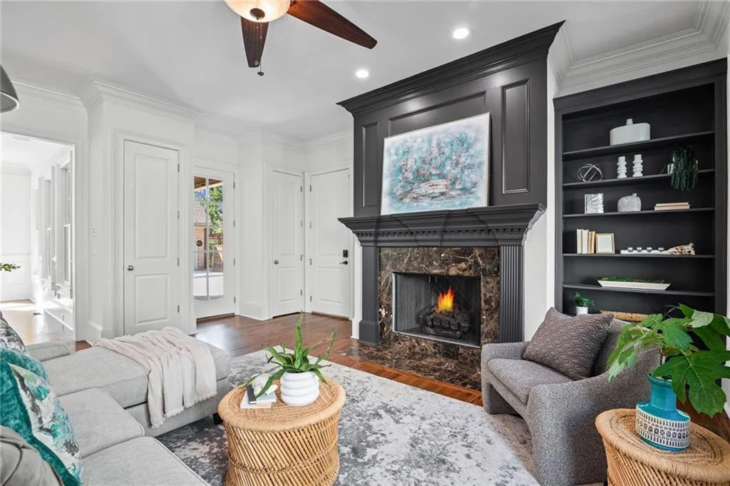 Leads to patio with outdoor kitchen and pool area
