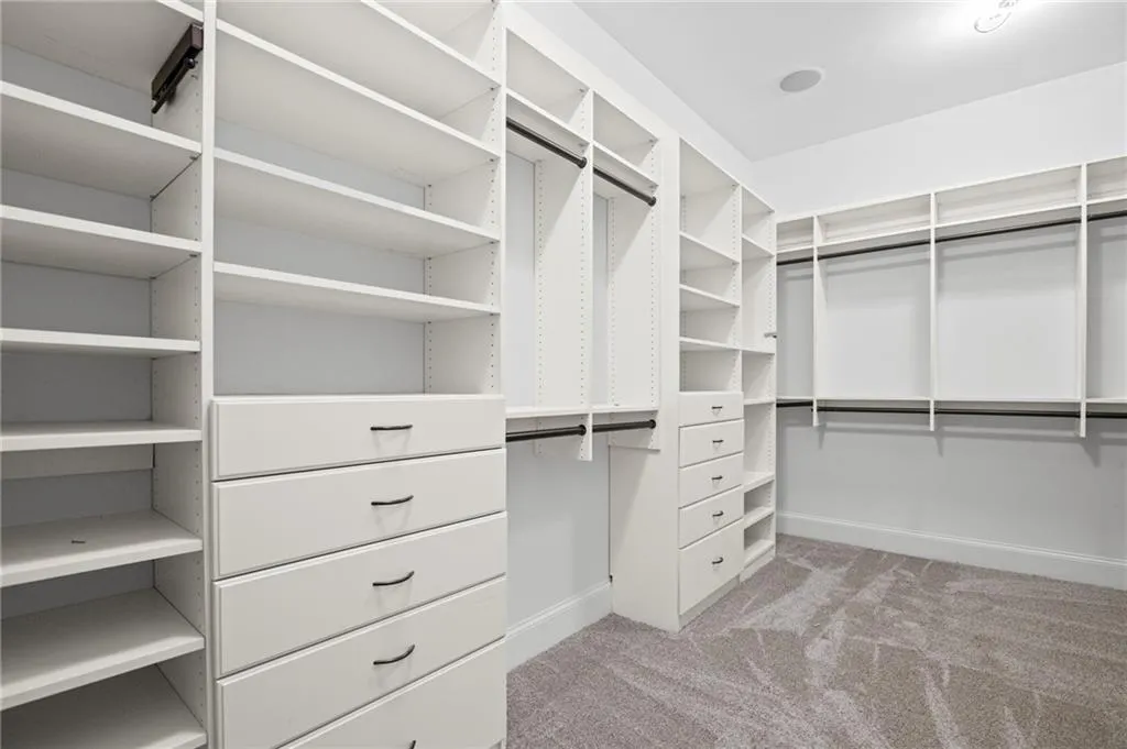 Extra large custom walk in closet in primary suite