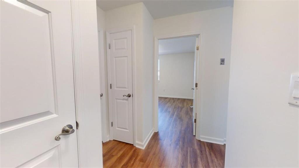 Hall with wood-type flooring