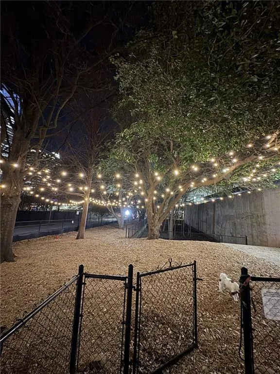 Dog Park at night featuring gated, access card entrance fence.