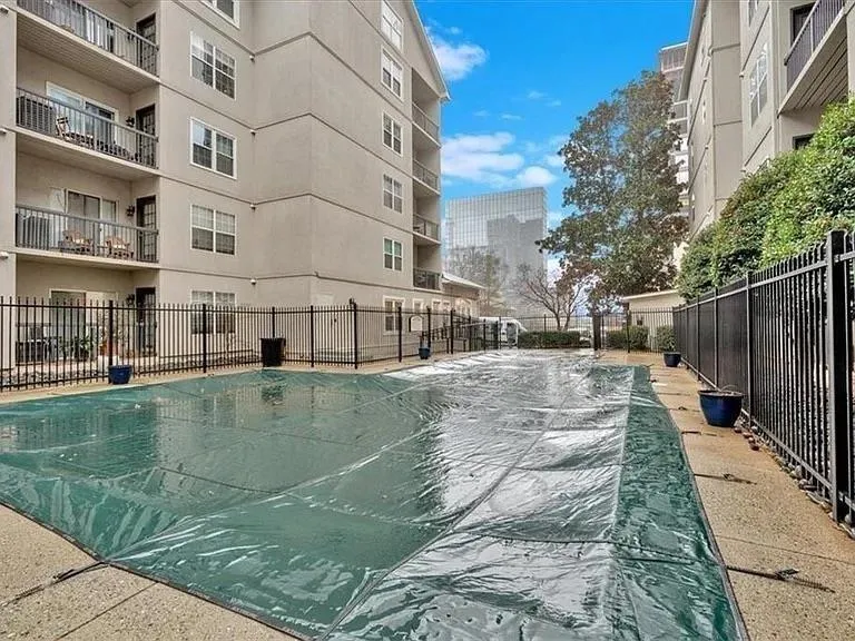 Community pool featuring fence