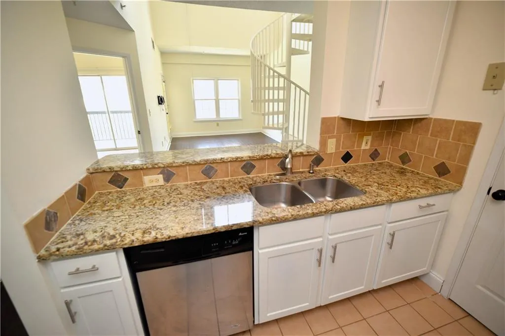 White cabinets, sink, and dishwasher