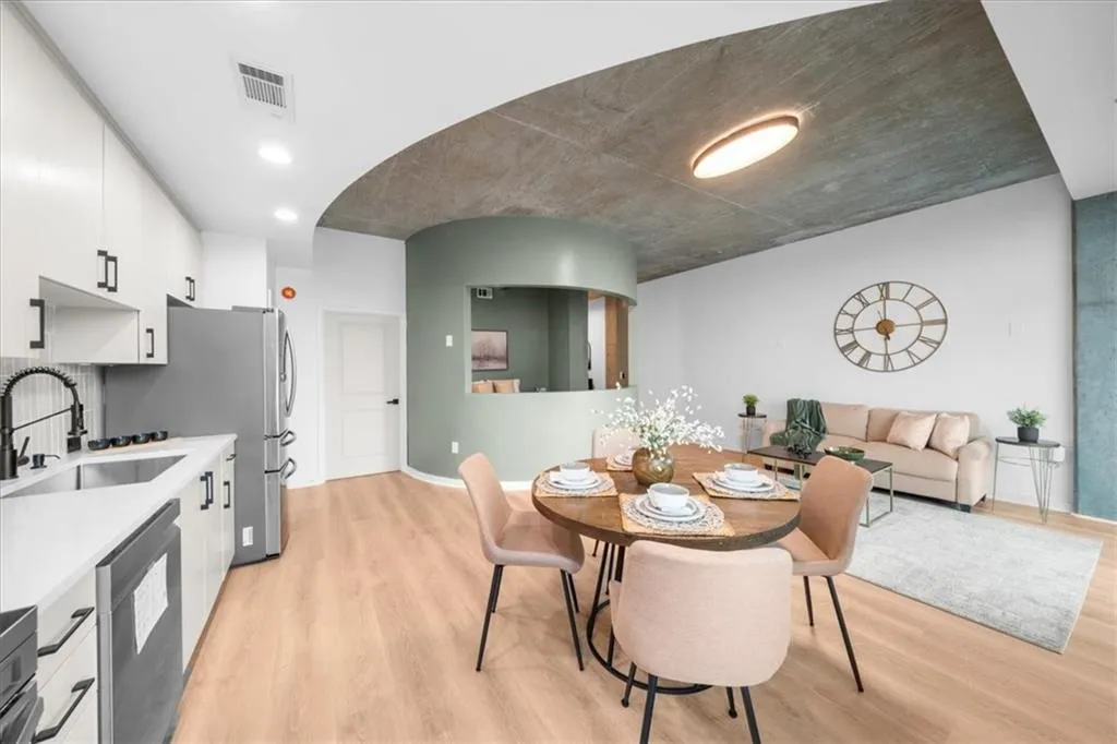 Dining space featuring light wood finished floors and recessed lighting