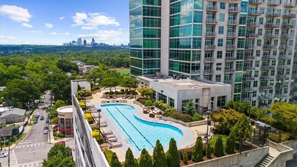 Drone / aerial view of a pool area and skyline