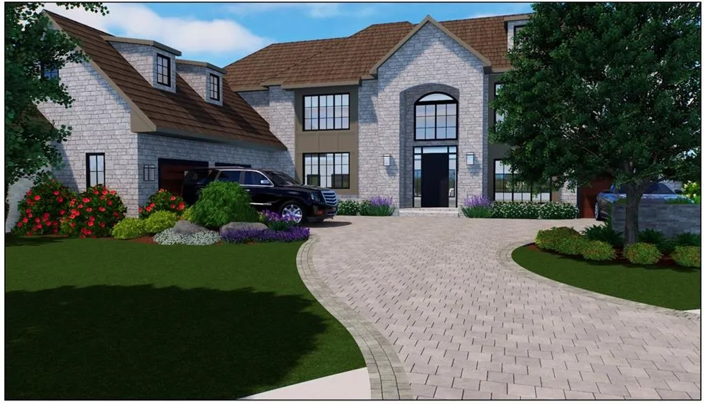 French country inspired facade featuring curved driveway, stone siding, and a front yard