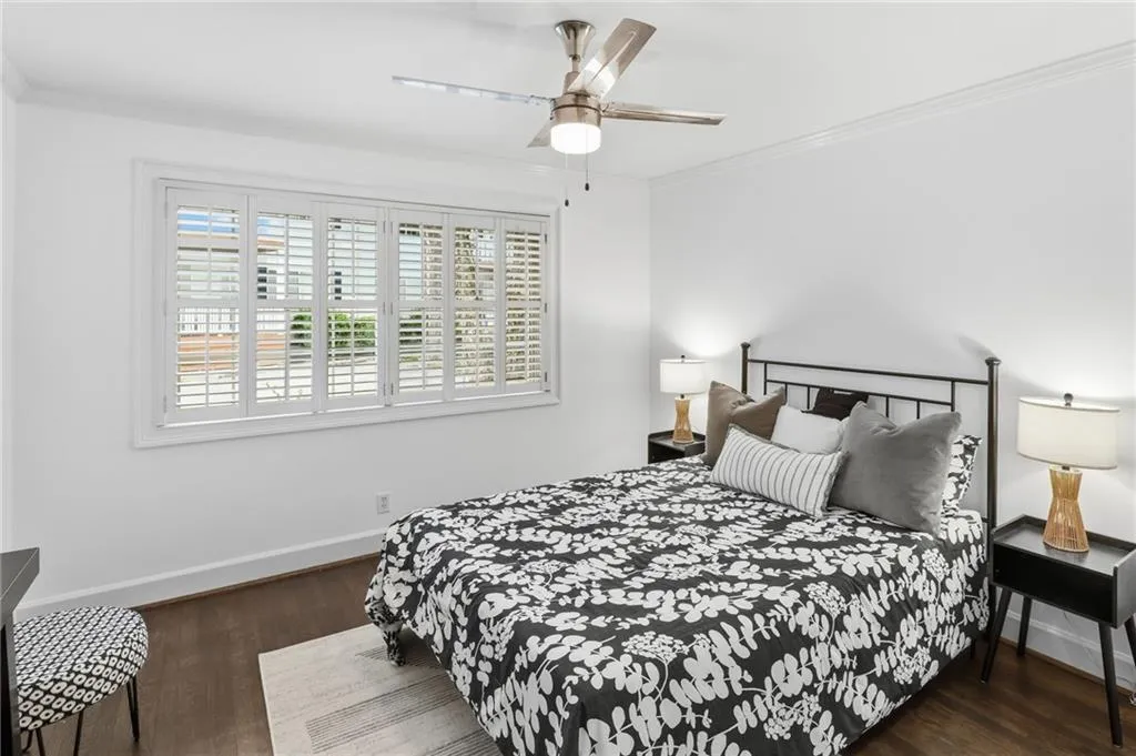 Bedroom with hard wood floors, new ceiling fan, freshly painted interior!