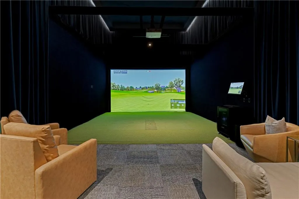 Rec room featuring golf simulator and carpet floors
