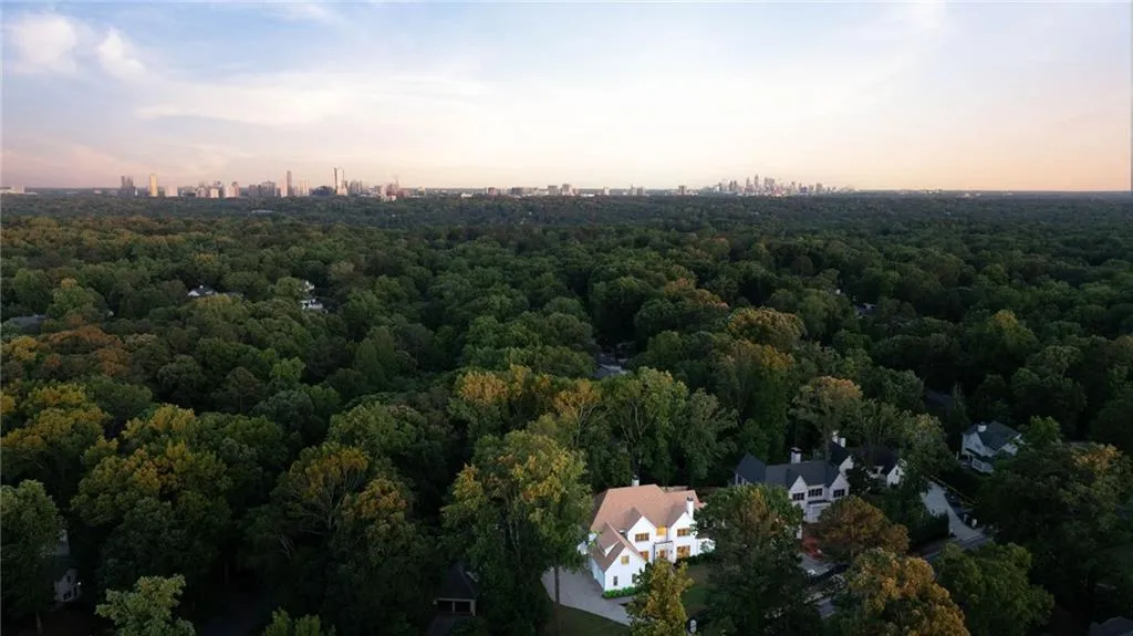 Aerial view of property's location with a forest