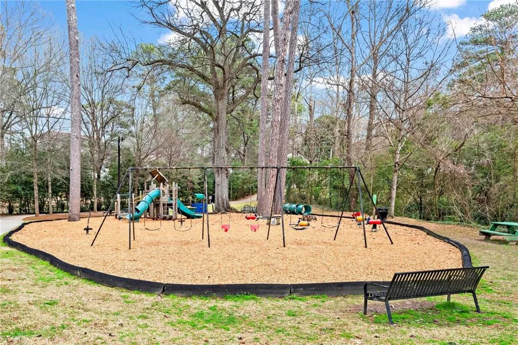 Communal playground with view of wooded area