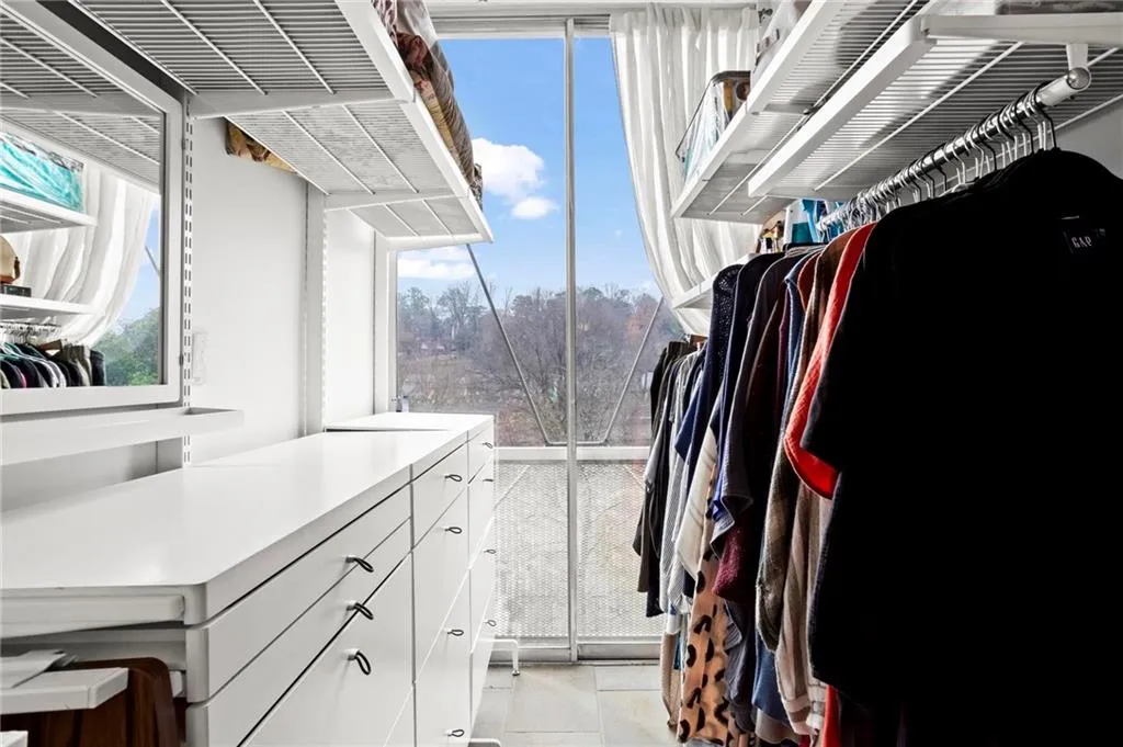 Spacious closet featuring light tile patterned flooring