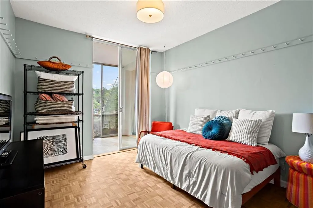 Bedroom with access to exterior and floor to ceiling windows