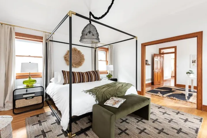 Bedroom featuring light hardwood / wood-style flooring and multiple windows