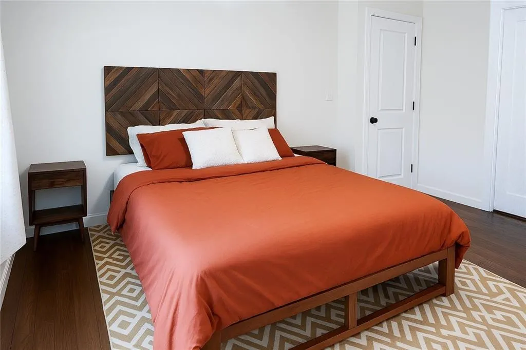 Bedroom with wood finished floors