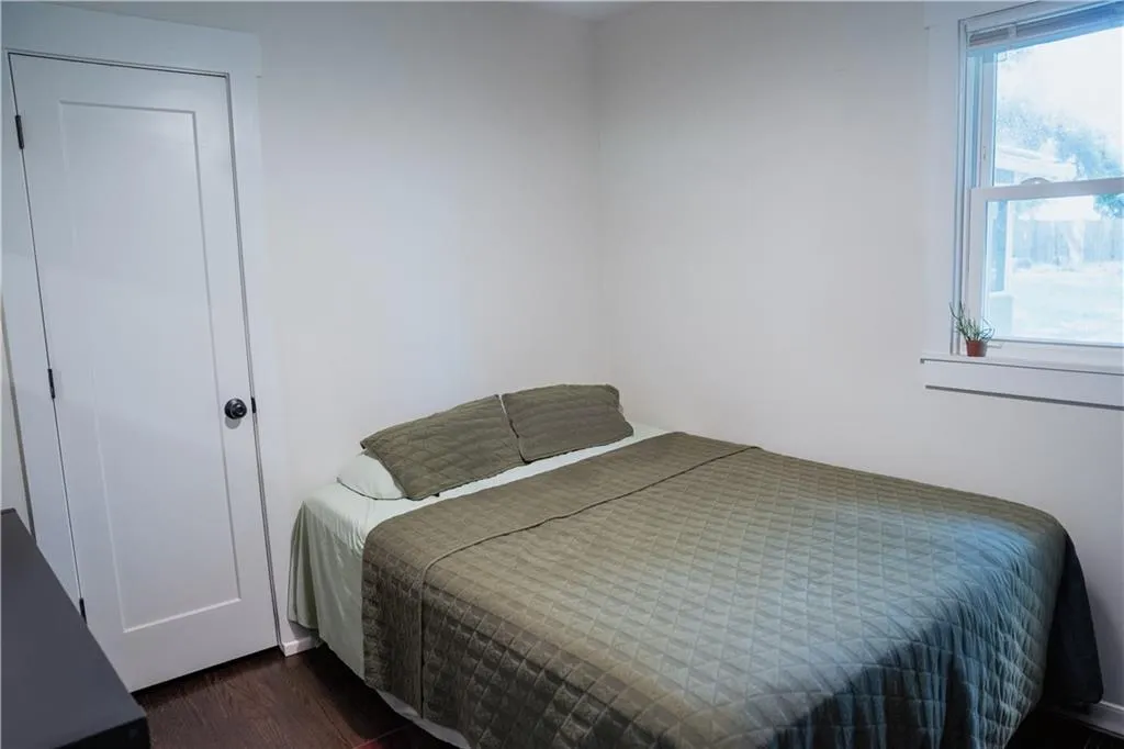 Bedroom featuring dark wood finished floors