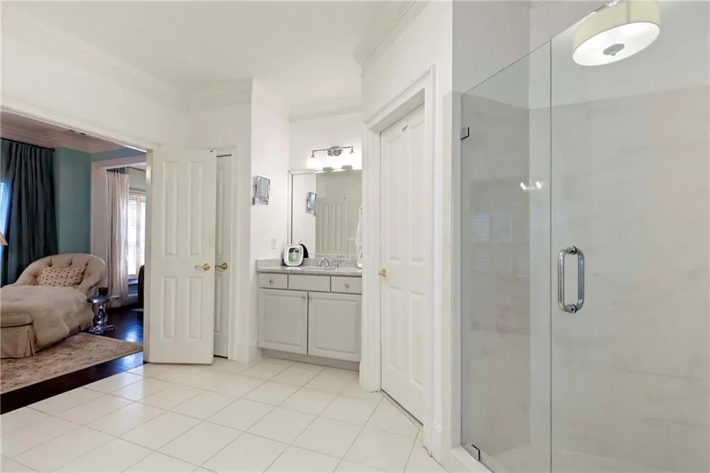 The primary bathroom has been updated with lovely marble countertops