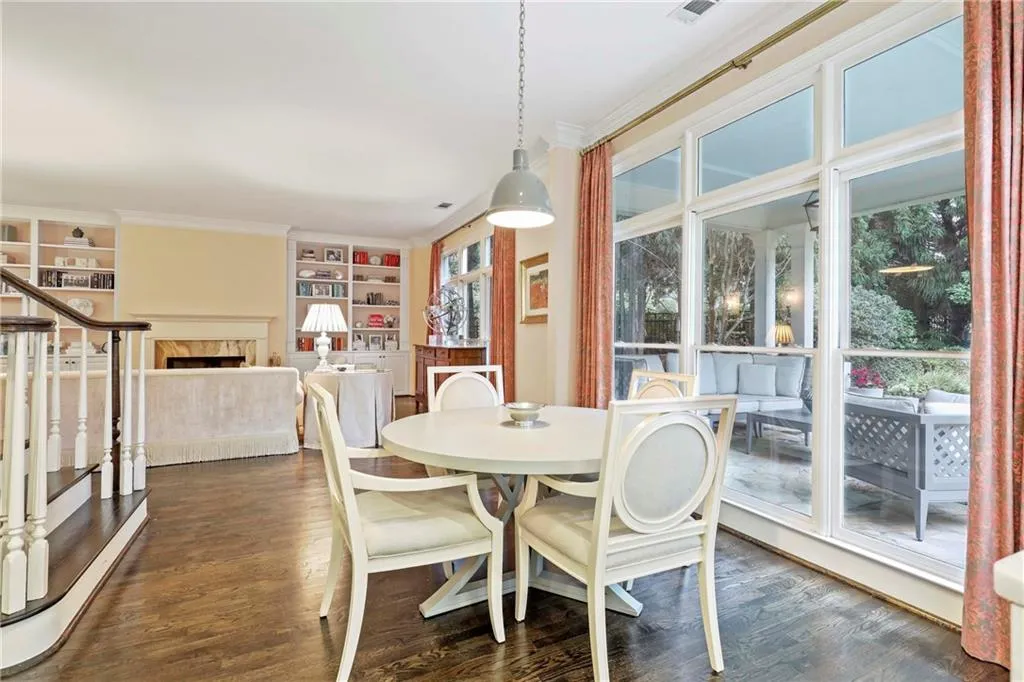 The breakfast table overlooks the serene and lush backyard
