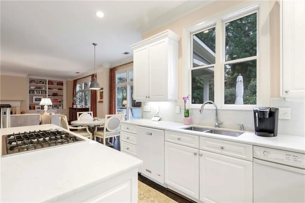 The kitchen opens to the breakfast area and sophisticated living room