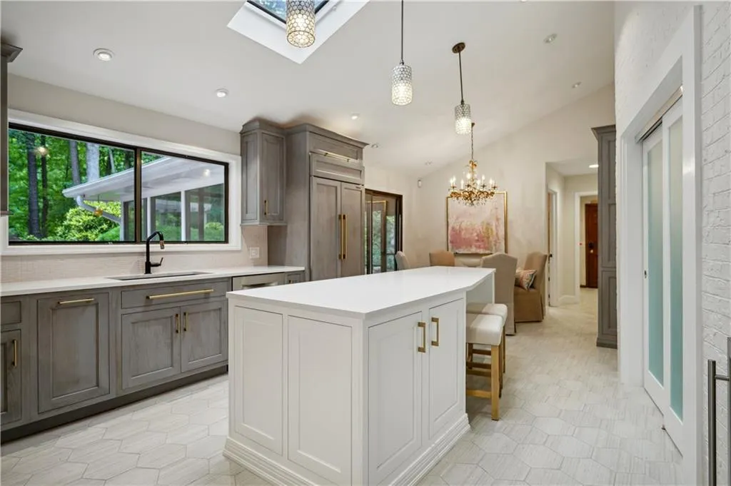 SubZero refrigerator with matching cabinetry paneling