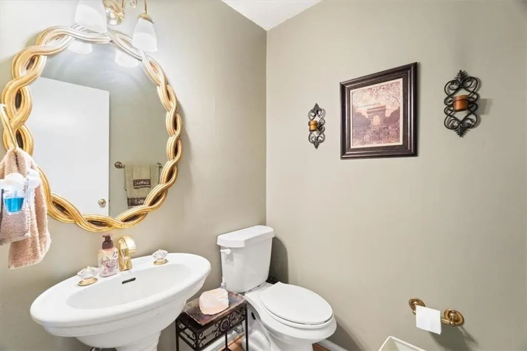 Bathroom featuring toilet and a sink