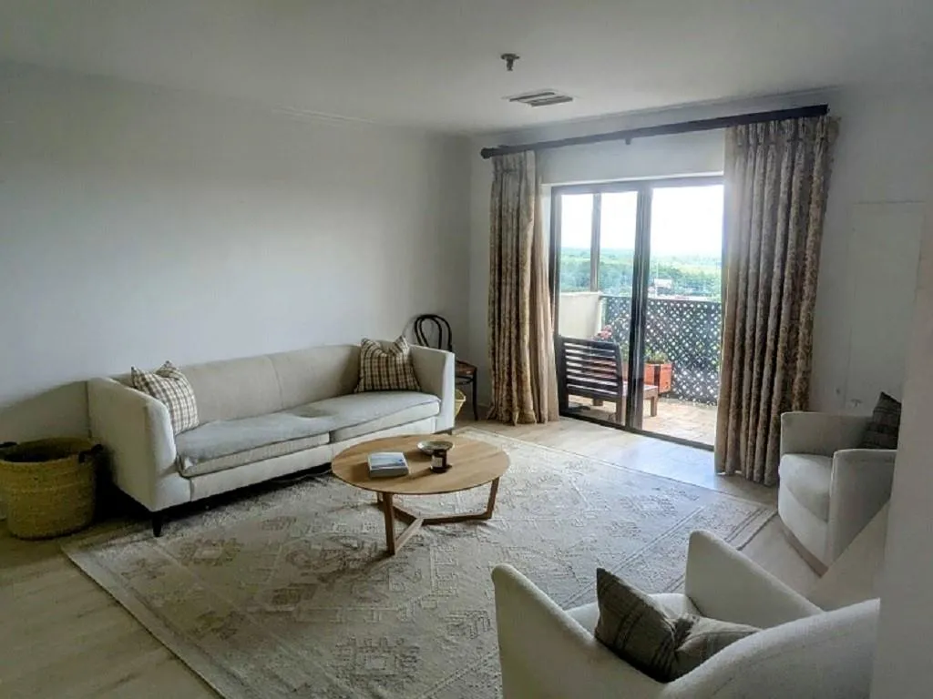 Living room with wood-type flooring
