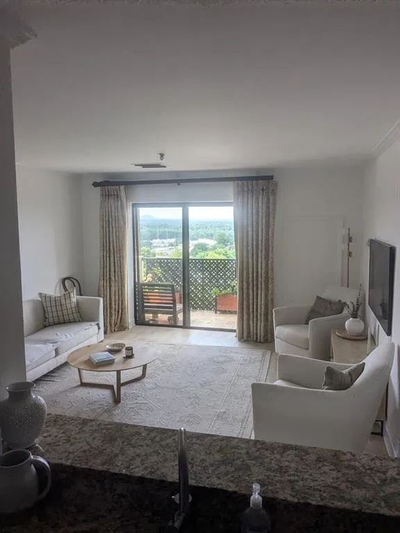 Living room with light wood-type flooring