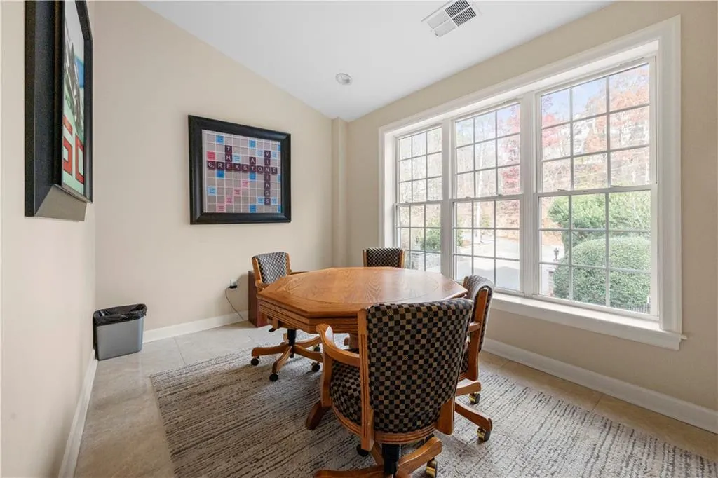 Game room, perfect for small private meetings or poker nights, with a view overlooking the Greystone entrance driveway.