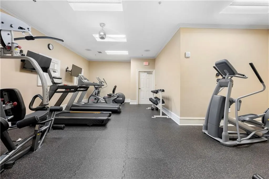 Fully equipped gym on the lower level, featuring bathrooms with showers and locker rooms.