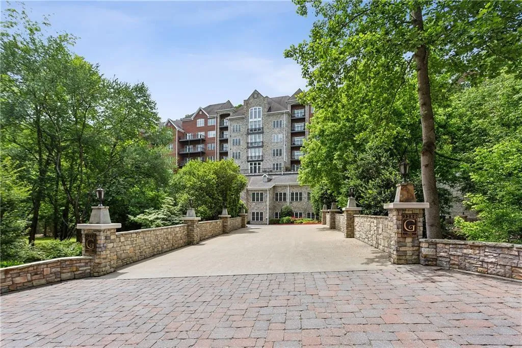 Introducing Greystone Unit 410 - where luxury meets convenience in Vinings, a rare two story condo.