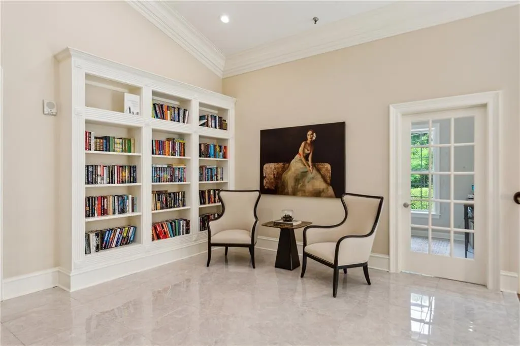 Relax in the cozy sitting area and discover your next favorite book in the library.